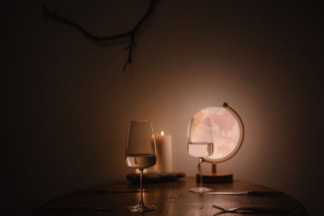 Illustration photo: wine glasses standing on a wooden table